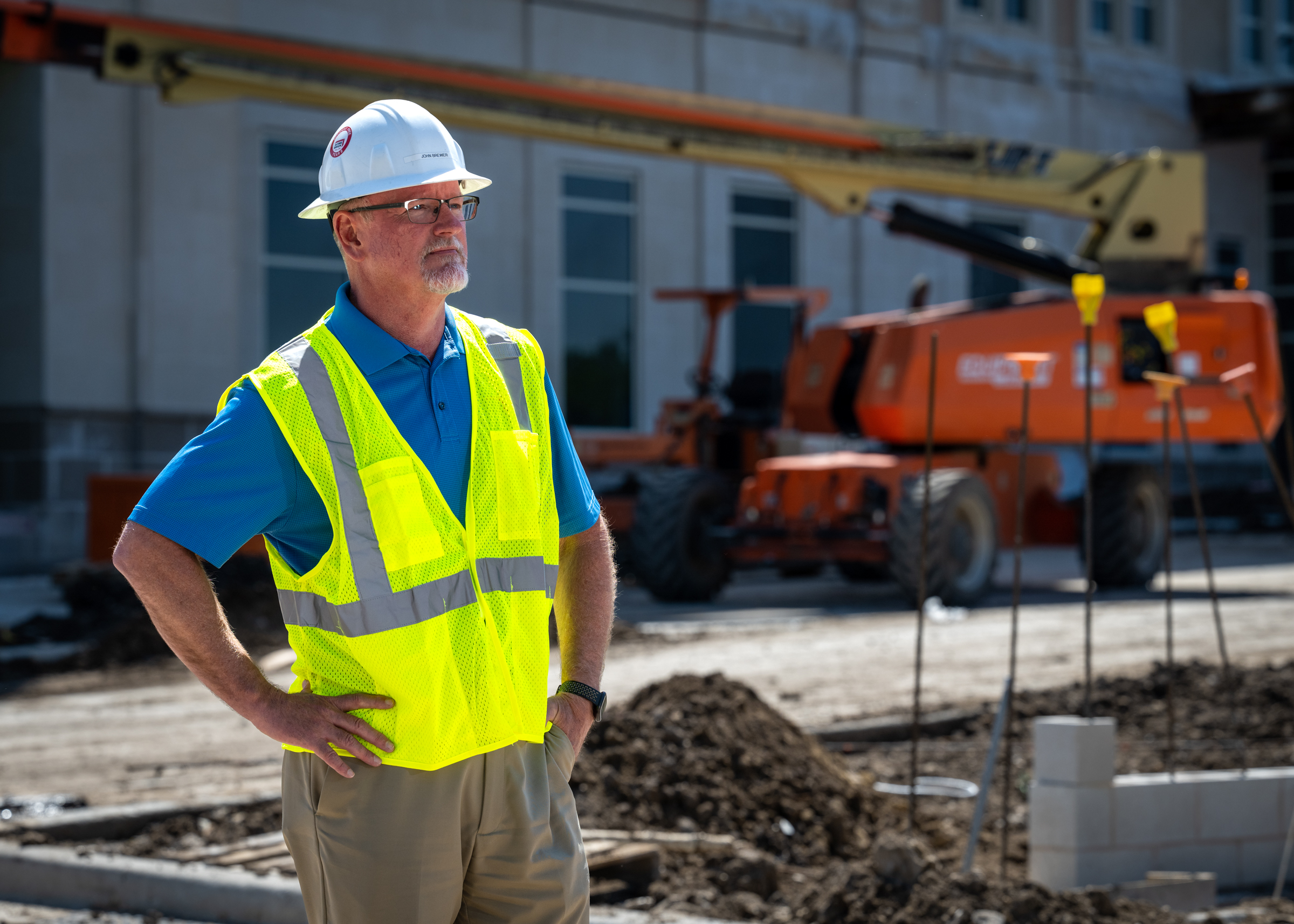 John Brewer of Acme Brick standing in construction site